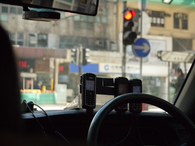 hong kong taxi driver cell phones